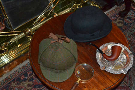 fancy dress objects associated with detective work on a tableの写真素材