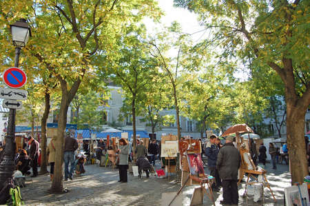 Montmartre, France - October 31, 2012: Place du Tertre in Montmartre, Paris with street artists and paintings. The area is a popular tourist attraction in Paris.のeditorial素材