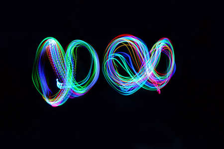 Two infinity signs on black background