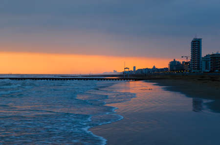 A skyline of a city of Jesolo at the sunsetの写真素材