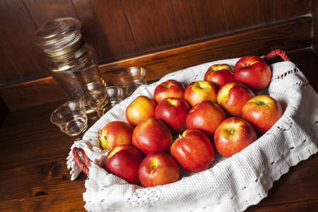 Peaches in a basket on a wooden mobileの写真素材