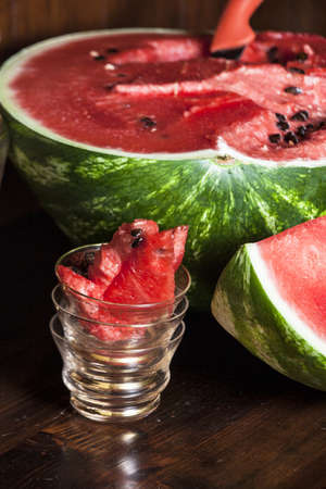 Watermelon cut on a wooden mobileの写真素材
