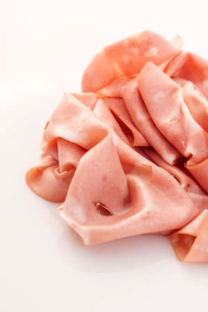 Slices of Italian mortadella on a white backgroundの写真素材
