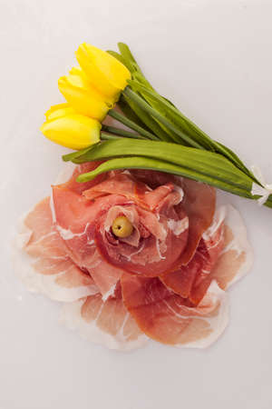 Slices of ham in white backgroundの写真素材