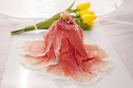 Slices of ham in white backgroundの写真素材