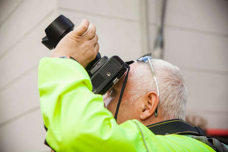 Adult man with jacket acid green shoots skyのeditorial素材