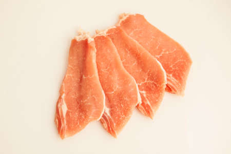 Pork loin sliced ââon a white backgroundの写真素材