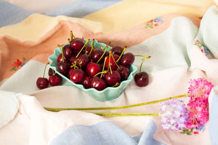 Italian Cherries in a blue bowlの写真素材