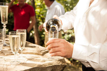 Preparation for the toast the newlyweds outside the church.の写真素材