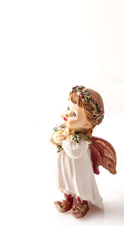 Pretty clay cherub on a white background.の写真素材