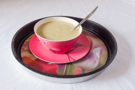 Fresh summer soup of cucumber, potatoes, basil and yogurt