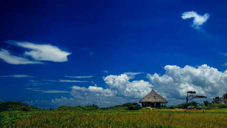 The sky in the clouds and the little hutの写真素材
