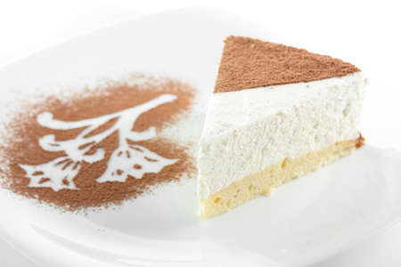 Peace of cake on white dish and white backgroundの写真素材