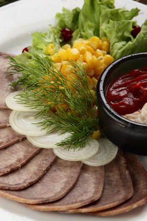 cold cuts of meat with different vegetablesの写真素材