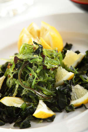 fresh and tasty european salad on white dishの写真素材
