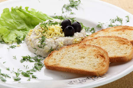 salad with roasted bread in white dishの写真素材