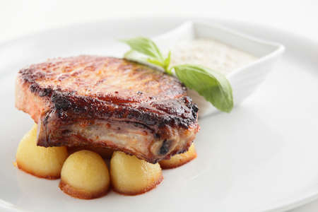 hot and tasty roasted meat on white dishの写真素材