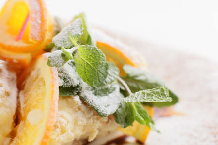 fresh and tasty cake on white dish and white backgroundの写真素材