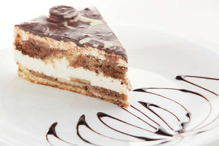 fresh and tasty cake on white dish and white backgroundの写真素材