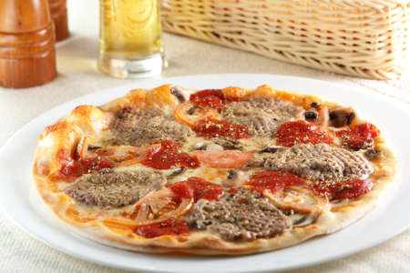 Fresh and hot pizza on the tableの写真素材
