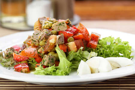 Fresh and tasty salad on the wooden tableの写真素材
