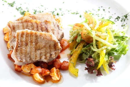 Fresh and tasty salad on the wooden tableの写真素材