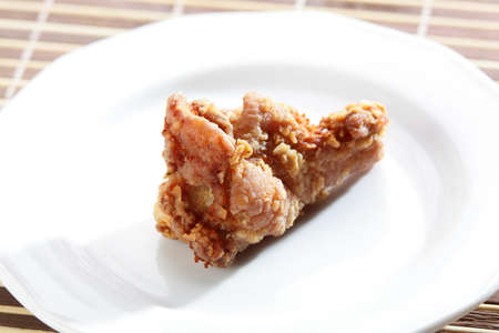 Hot roasted chicken leg in white dishの写真素材