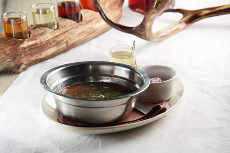 tasty and hot soup with carrot and garnishの写真素材