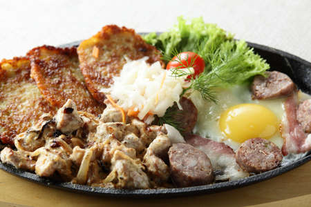 meat with egg and slapjacks in panの写真素材