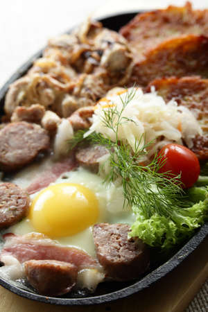 meat with egg and slapjacks in panの写真素材