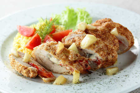 meat with garnish on white dishの写真素材