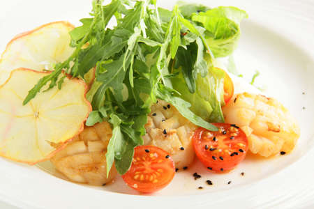 cold fresh and tasty european salad in white dishの写真素材