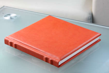 orange leather book on bright backgroundの写真素材