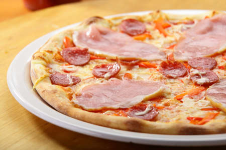 hot italian pizza with cheese and sauceの写真素材