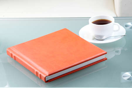 orange leather book on bright backgroundの写真素材