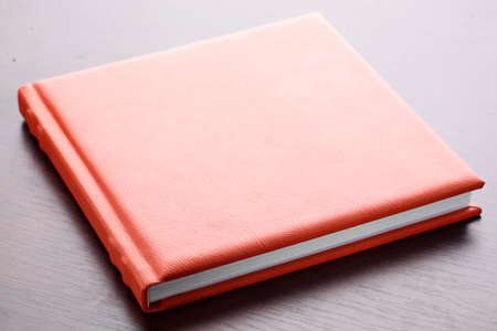 orange leather book on bright backgroundの写真素材