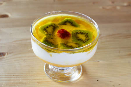 sweet ice cream with kiwi on wooden backgroundの写真素材