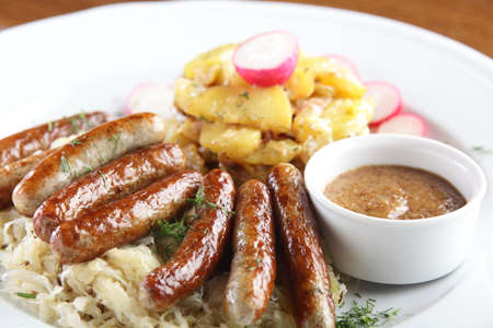 fresh and tasty peaces of meat with garnishの写真素材