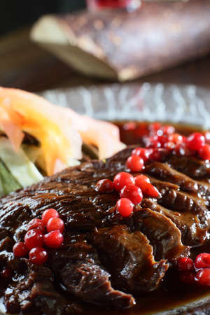 fresh and tasty peaces of meat with garnishの写真素材