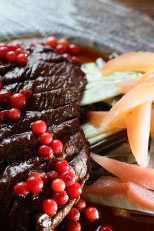 fresh and tasty peaces of meat with garnishの写真素材