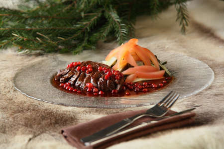 hot and tasty peaces of meat with garnishの写真素材