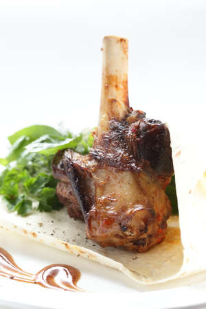 fresh and tasty pieces of meat with garnishの写真素材