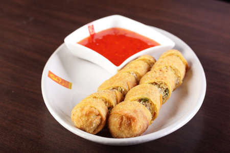 fresh tasty and colorful chinese food on wooden background