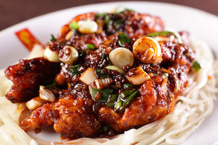 fresh tasty and colorful chinese food on wooden backgroundの写真素材