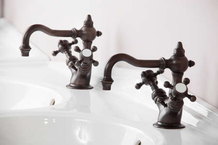 Brand new water tap on bright background