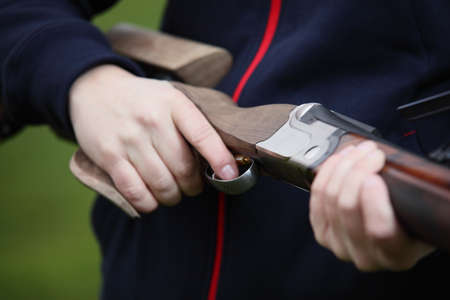 powerful gun with wooden butt and blackの写真素材