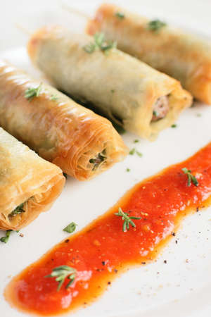 hot and tasty pancakes with red sauce