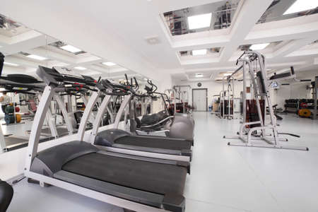 interior of new modern gym with equipment
