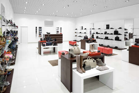 bright and fashionable interior of shoe store in modern mall