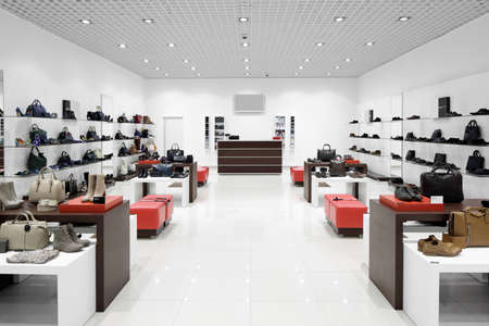 bright and fashionable interior of shoe store in modern mallの写真素材